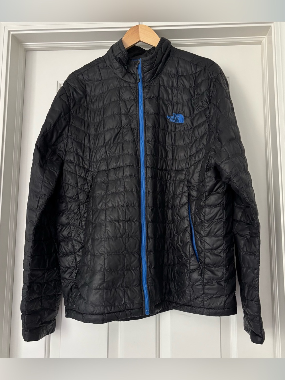 The North Face Men's Black Puffer Jacket with Blue Accents